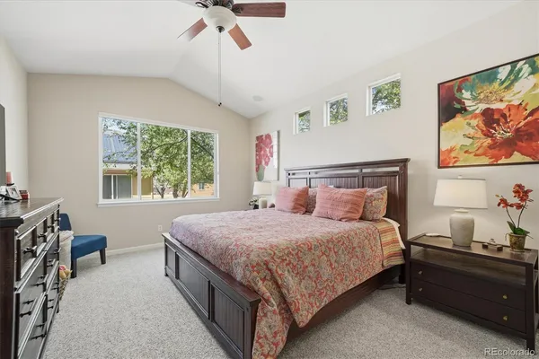 a bedroom with double bed and a window