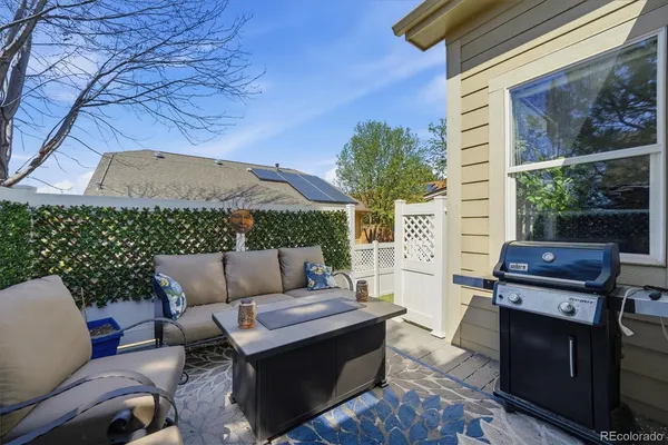 a backyard of a house with outdoor seating