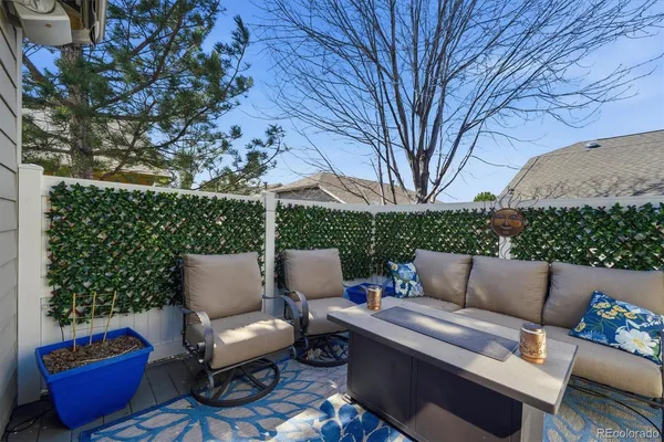 a building outdoor space with patio couch and a potted plant