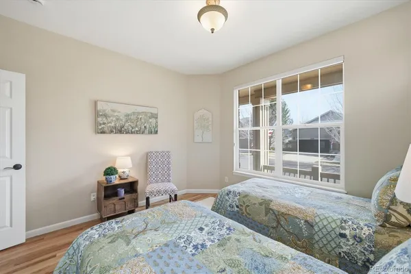 a bedroom with furniture and a window