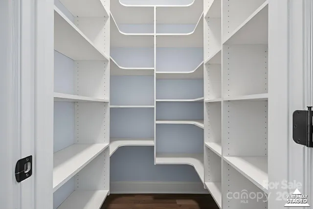 a bathroom with a granite countertop bathtub shower and toilet