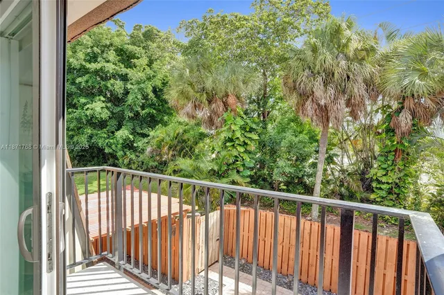 a view of a balcony with wooden floor