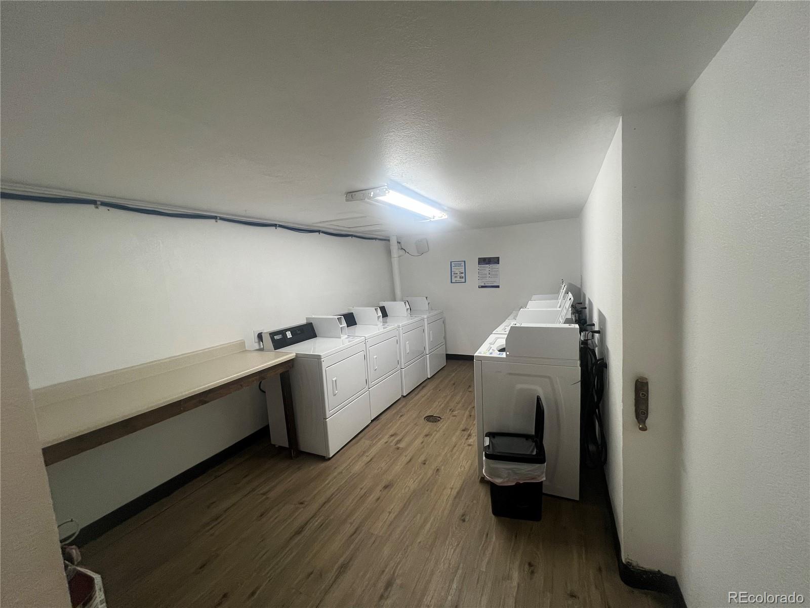 9876 Ryan Gulch Road, Unit 104 Silverthorne, CO 80498 - Photo 15 of 15 a room with furniture and wooden floor
