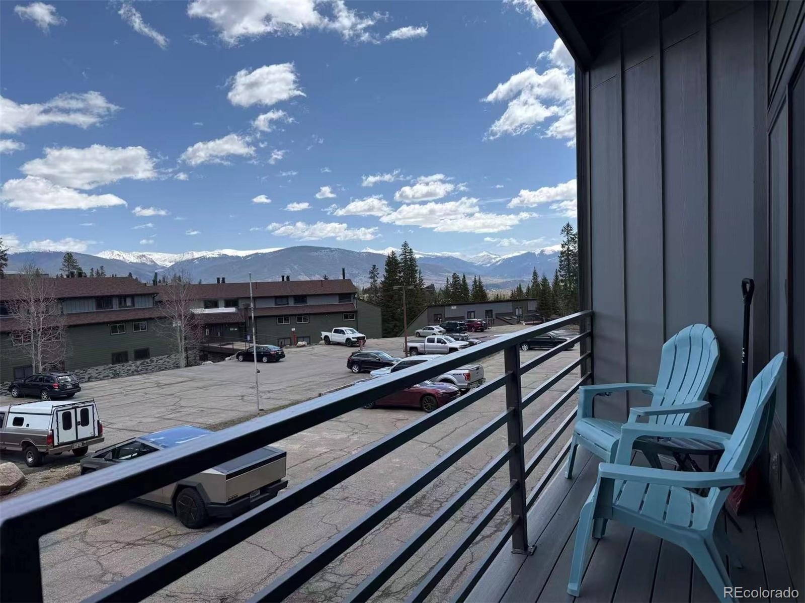 9876 Ryan Gulch Road, Unit 104 Silverthorne, CO 80498 - Photo 2 of 15 a view of a balcony with chairs