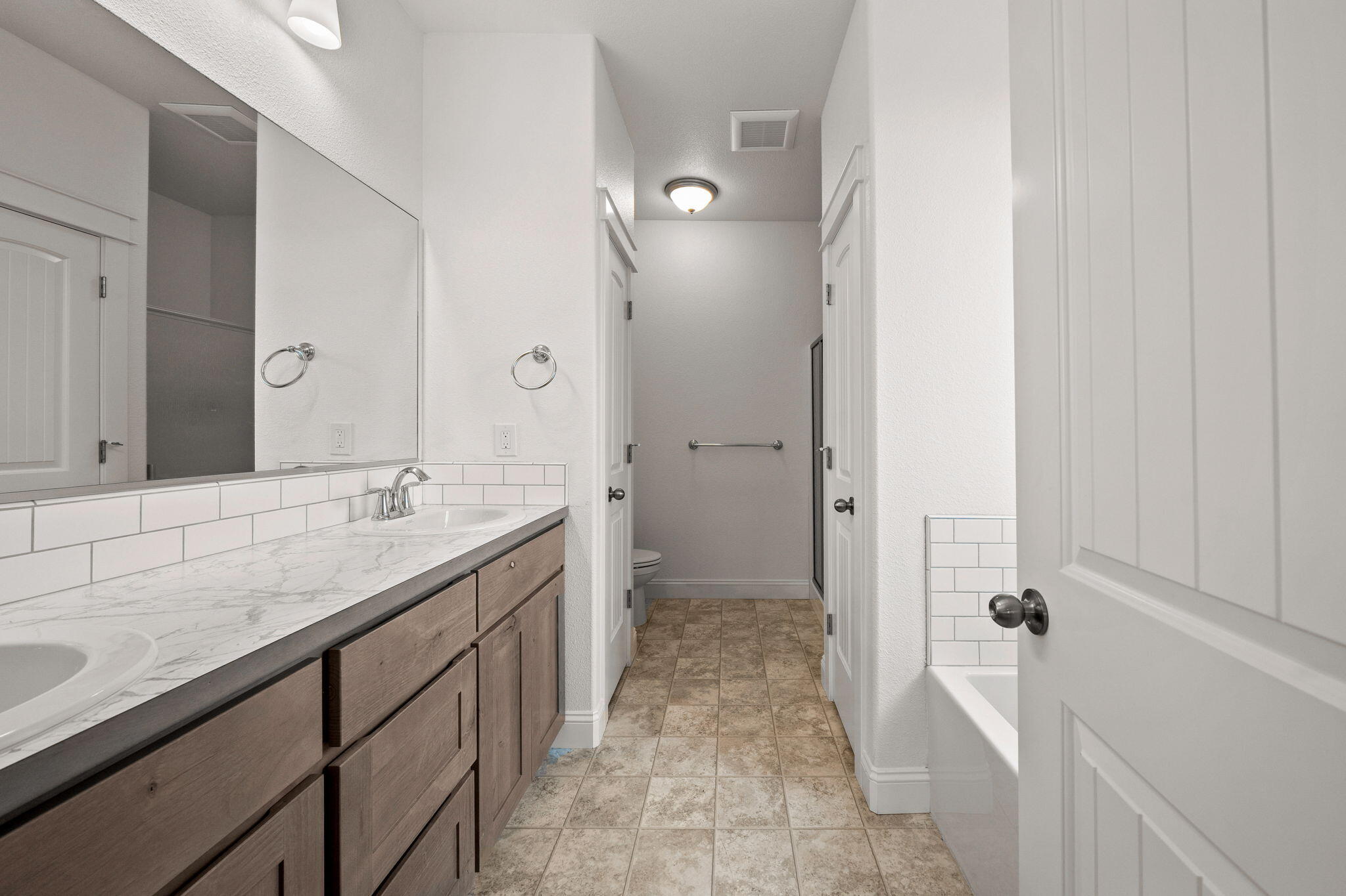 7590 Hopeful Place Shingletown, CA 96088 - Photo 24 of 31 a bathroom with a granite countertop sink a mirror and a shower