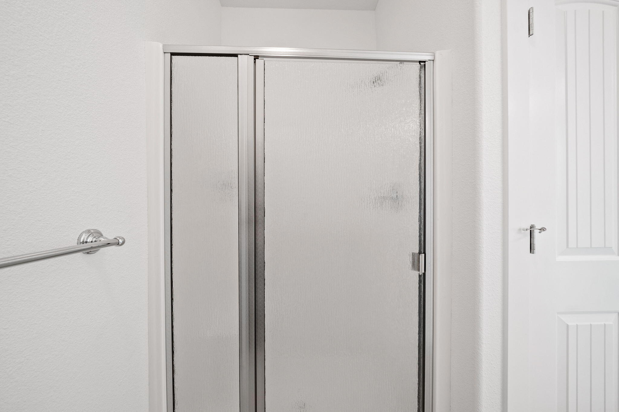 7590 Hopeful Place Shingletown, CA 96088 - Photo 26 of 31 a bathroom with a glass shower door