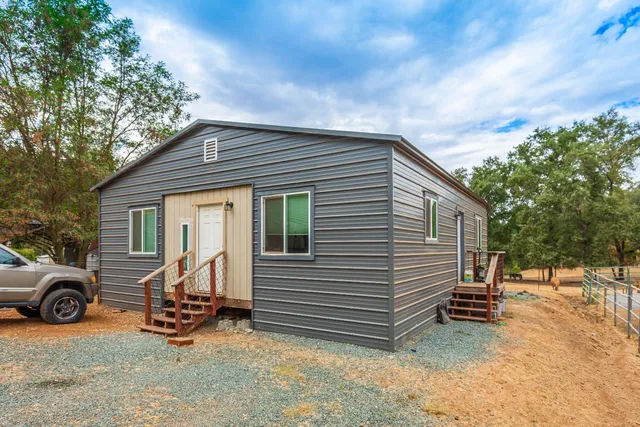 a porch with seating space and hardwood floor