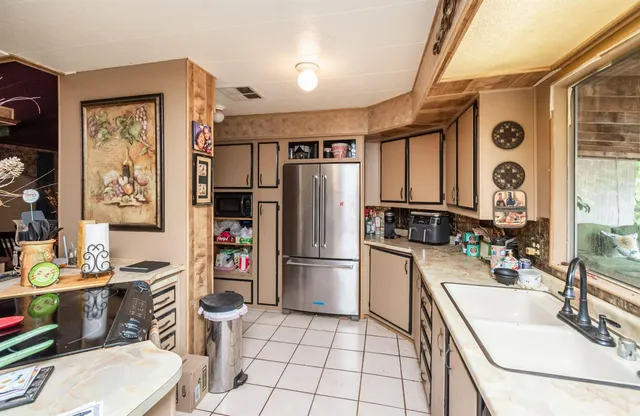 a view of a yard with a tree