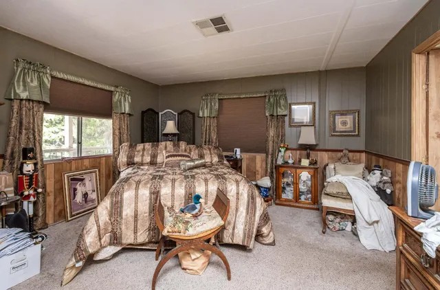 a view of empty room with wooden walls