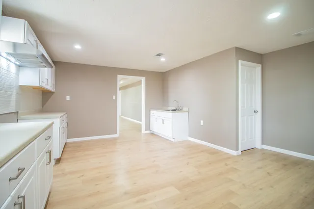 a view of a kitchen with a sink