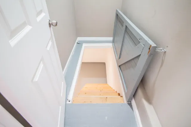 a view of staircase with rug