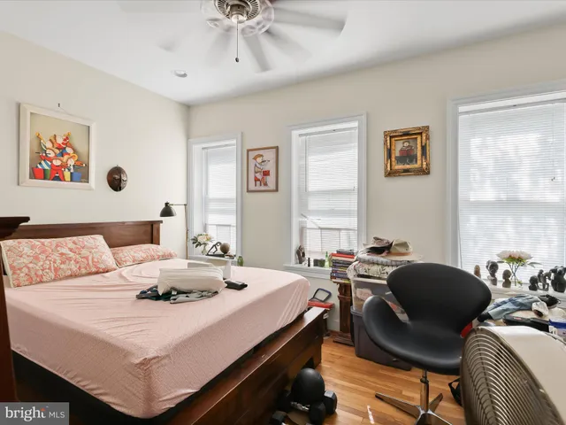 a view of a dining room with furniture and a large window