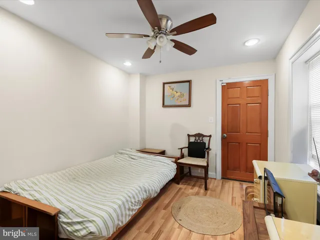 a bedroom with a bed and a dining table