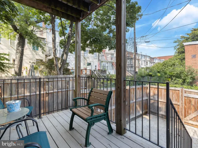 a view of a balcony with wooden floor