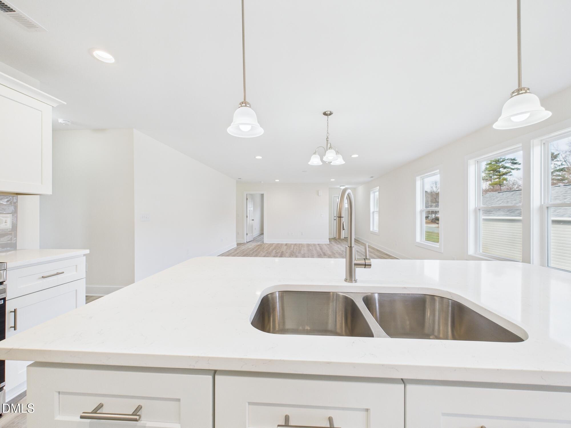 3602 Old Farm Court Graham, NC 27253 - Photo 10 of 25 a kitchen with a sink a counter space and cabinets