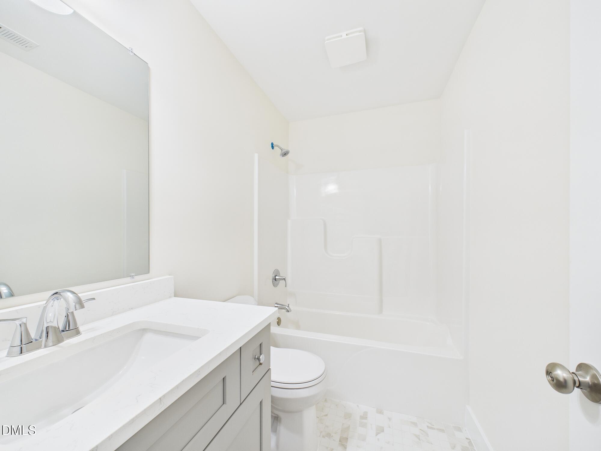 3602 Old Farm Court Graham, NC 27253 - Photo 18 of 25 a bathroom with a sink a toilet and shower