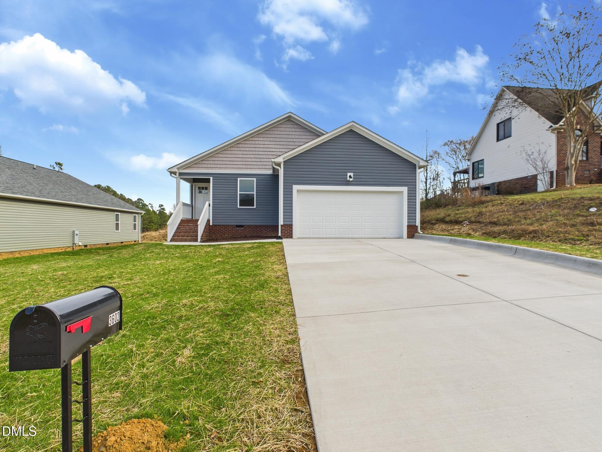 3602 Old Farm Court Graham, NC 27253 - Photo 3 of 25 a front view of a house with a yard