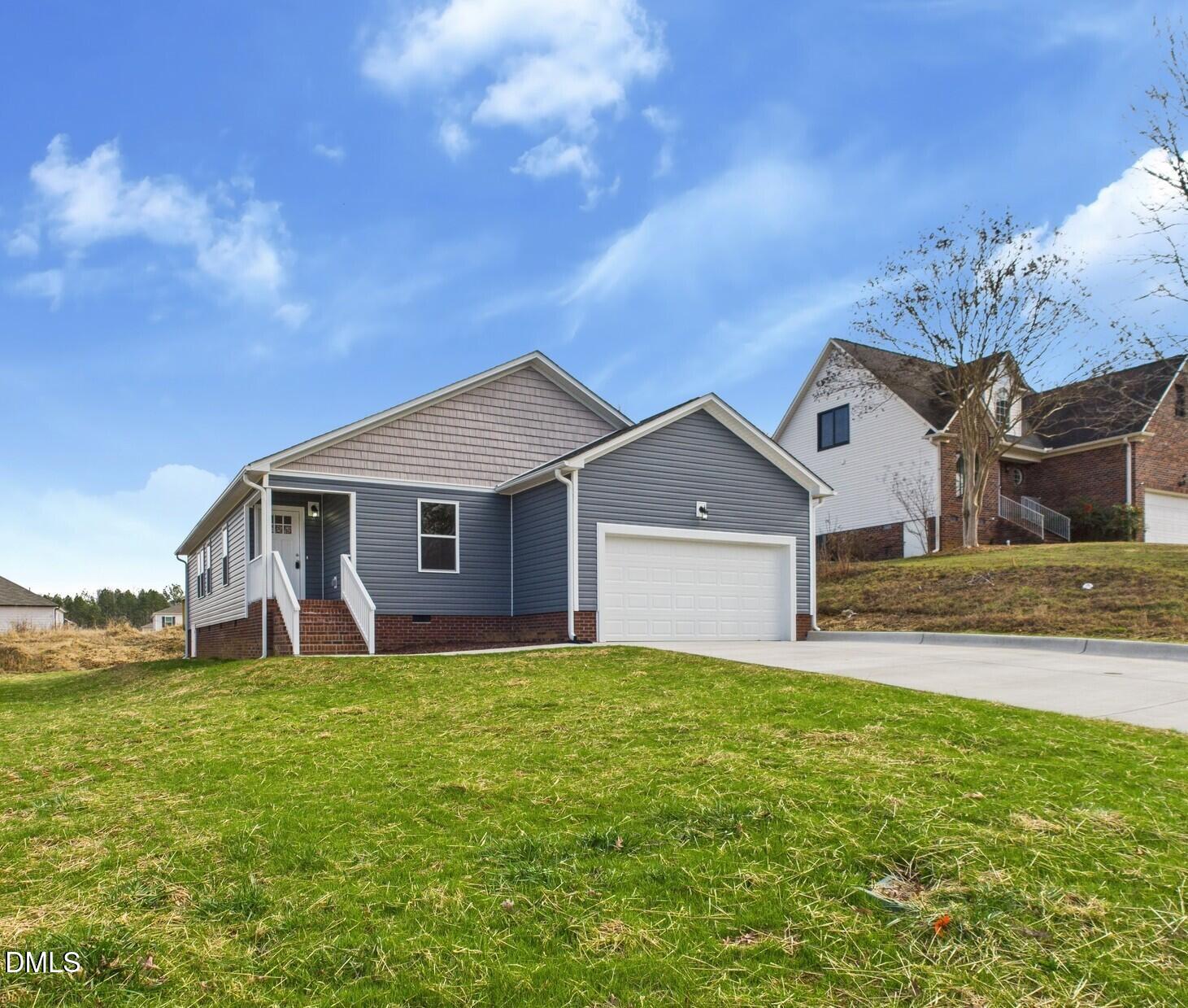 3602 Old Farm Court Graham, NC 27253 - Photo 4 of 25 a front view of a house with yard and large tree