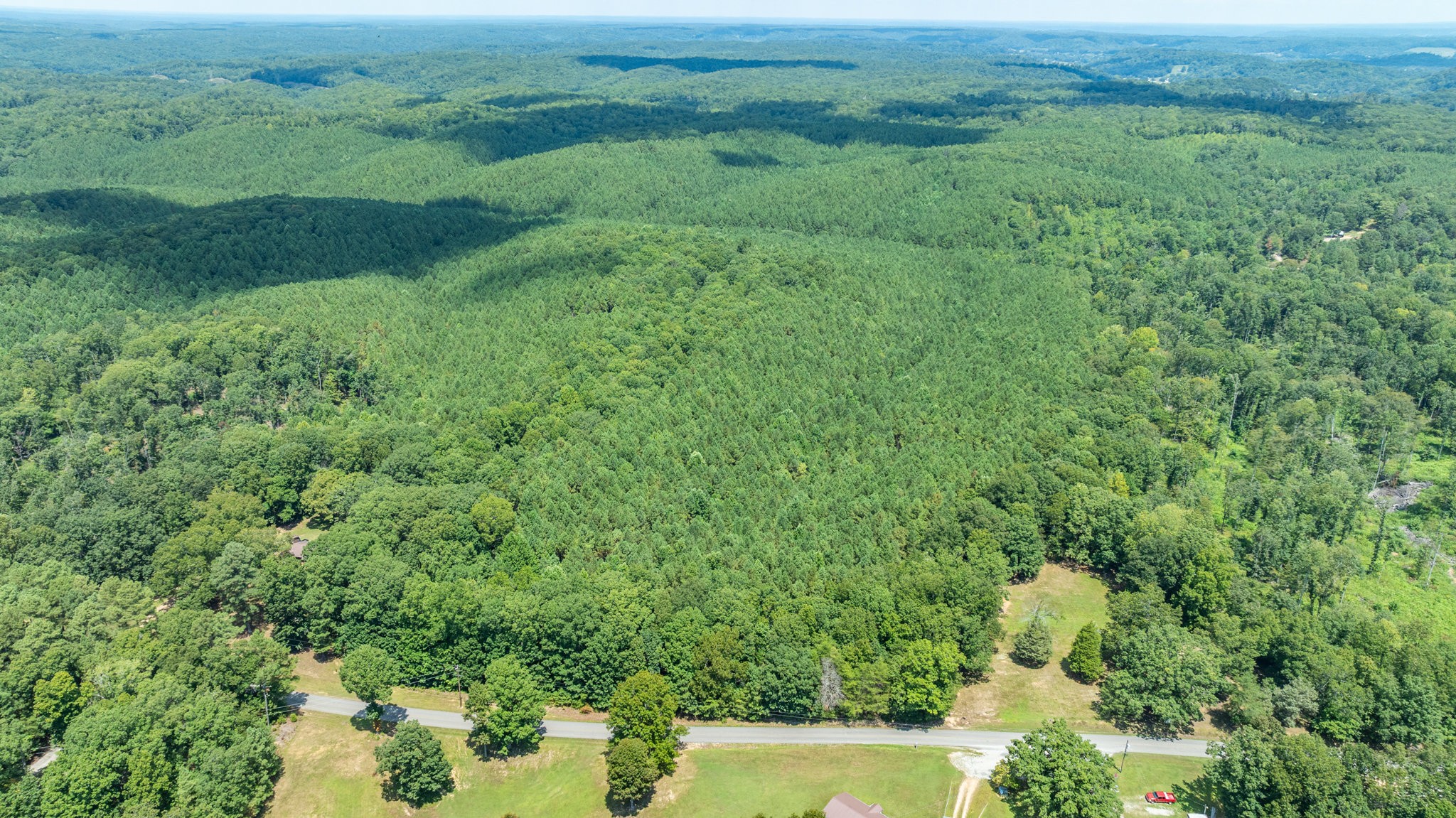0 Ridgetop Road Hampshire, TN 38461 - Photo 41 of 72 a view of a lush green outdoor space with a lake view