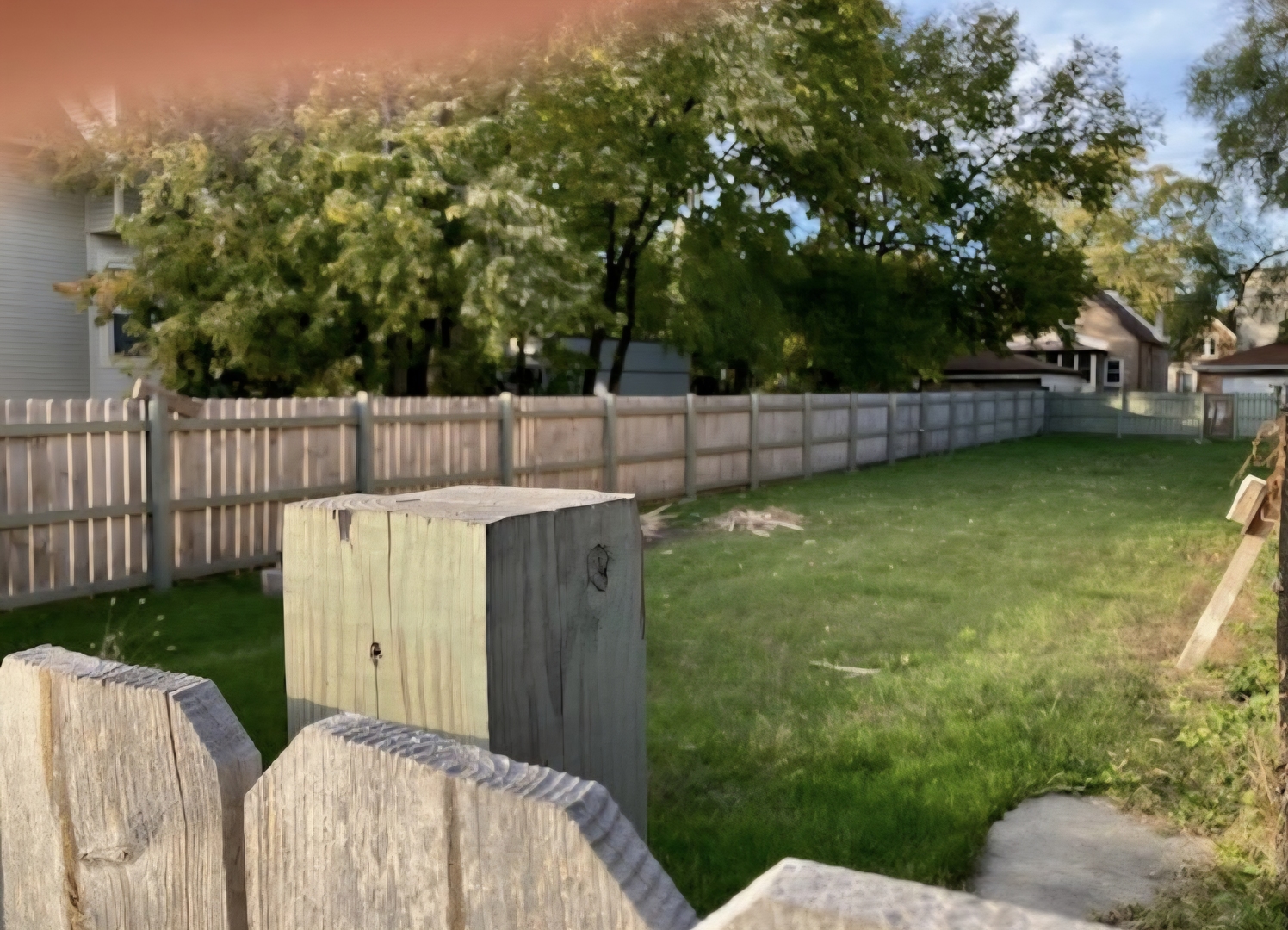 118 West 113th Place Chicago, IL 60628 - Photo 3 of 6 a view of a backyard with table and chairs