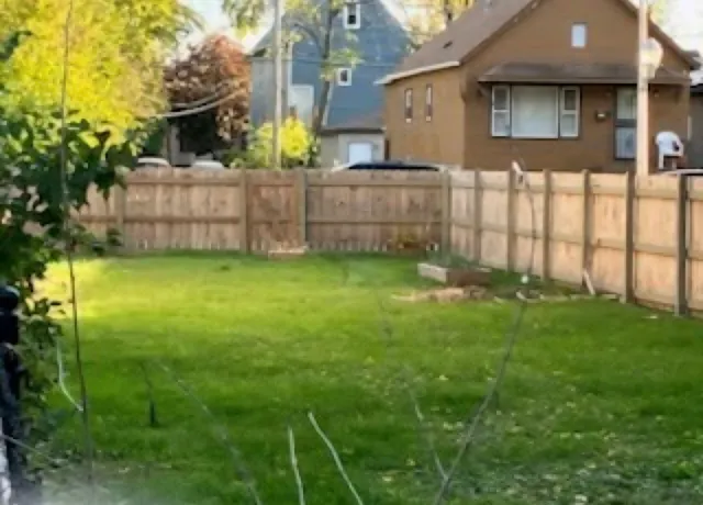 a view of backyard with green space