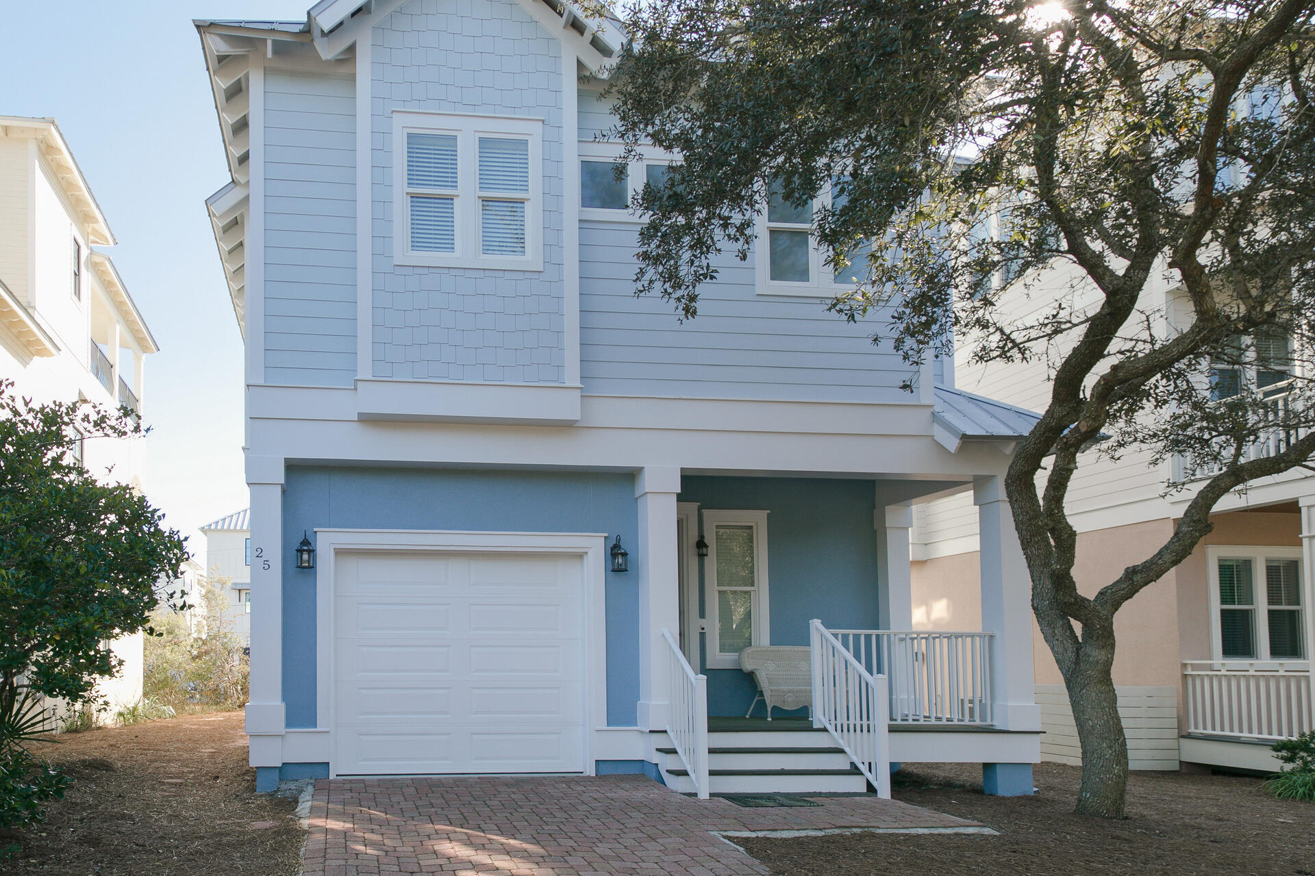 a front view of a house with a garage