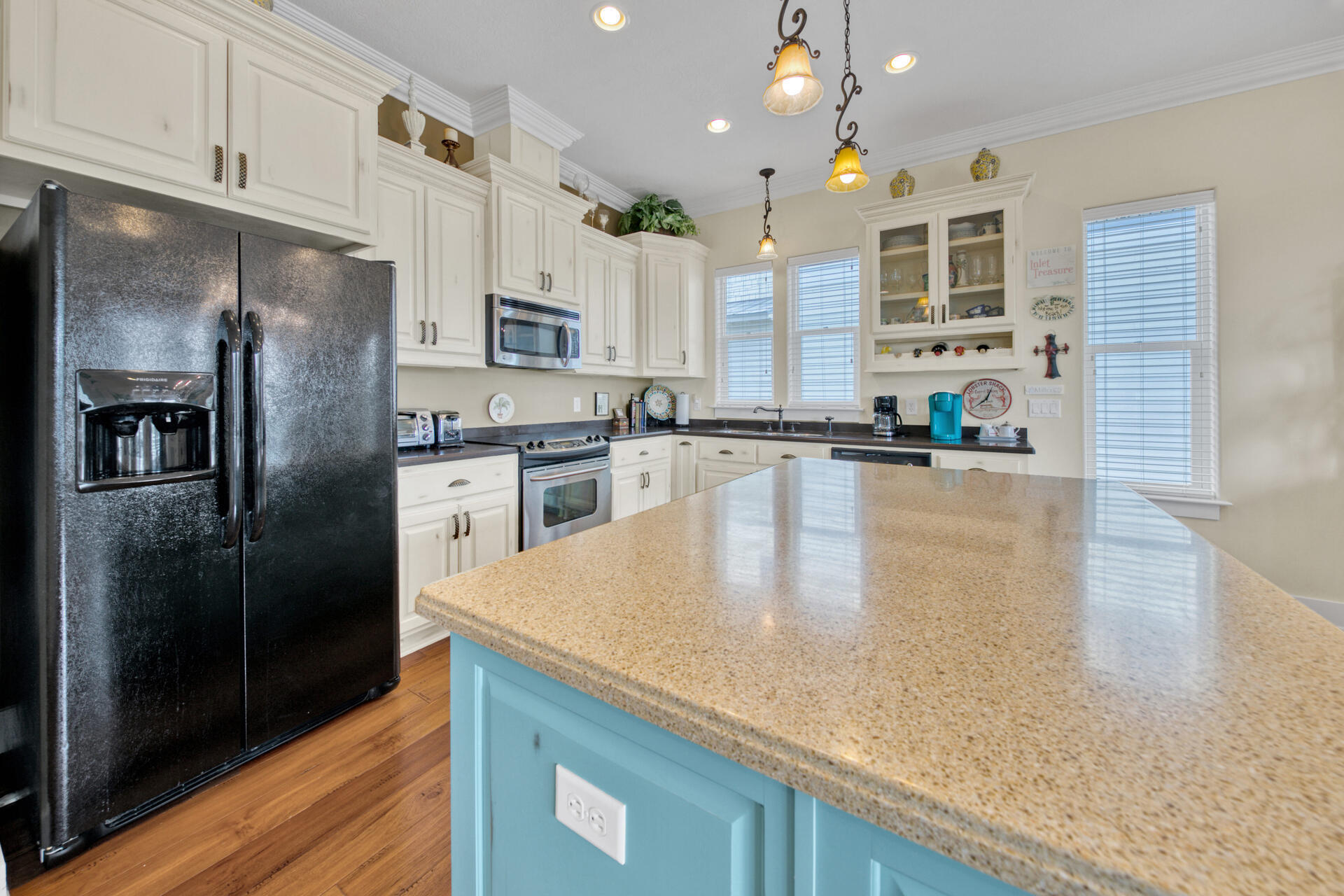 25 Pompano Place Inlet Beach, FL 32461 - Photo 11 of 76 a kitchen with stainless steel appliances granite countertop a sink a stove and a refrigerator