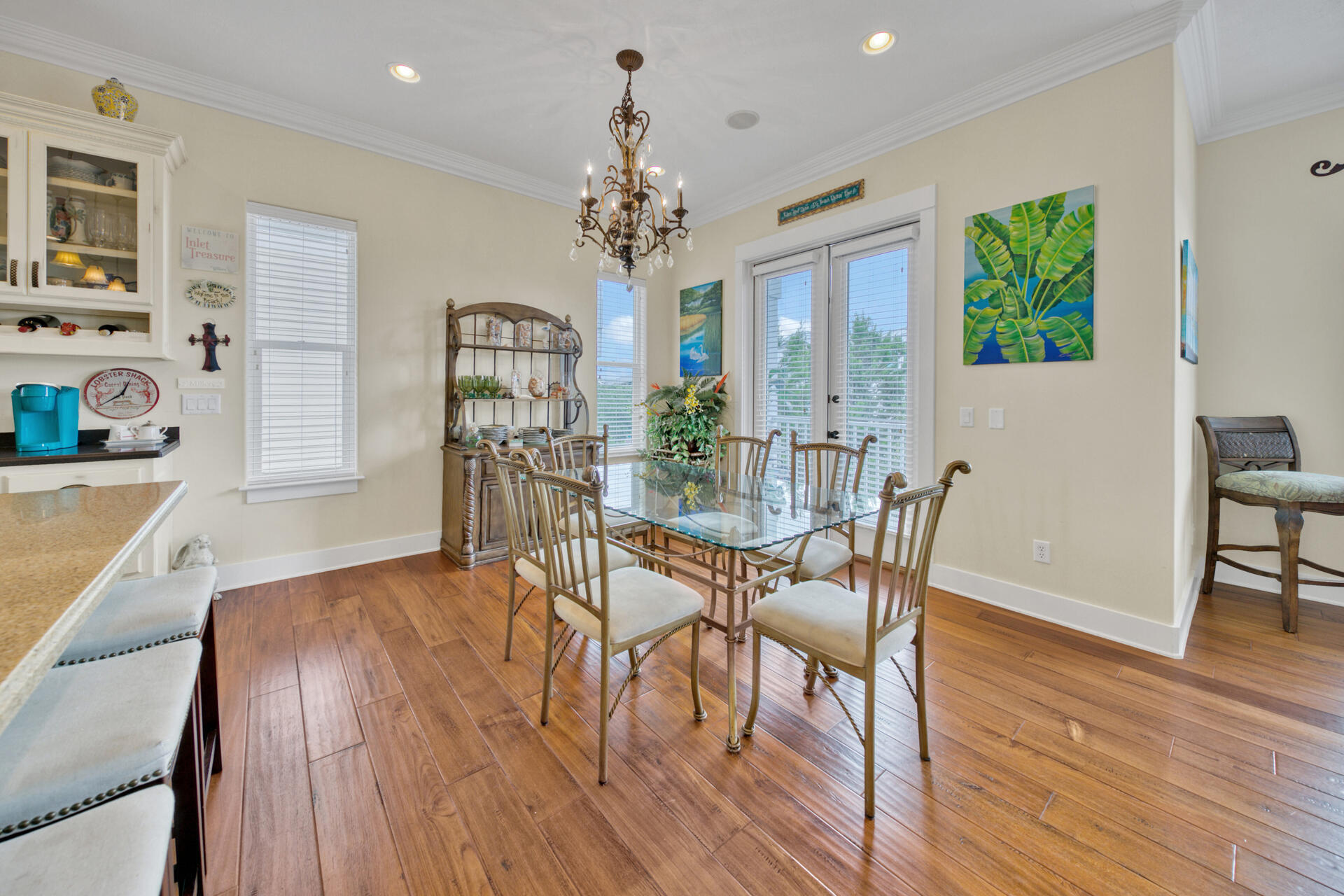 25 Pompano Place Inlet Beach, FL 32461 - Photo 19 of 76 a view of a dining room with furniture a chandelier and wooden floor