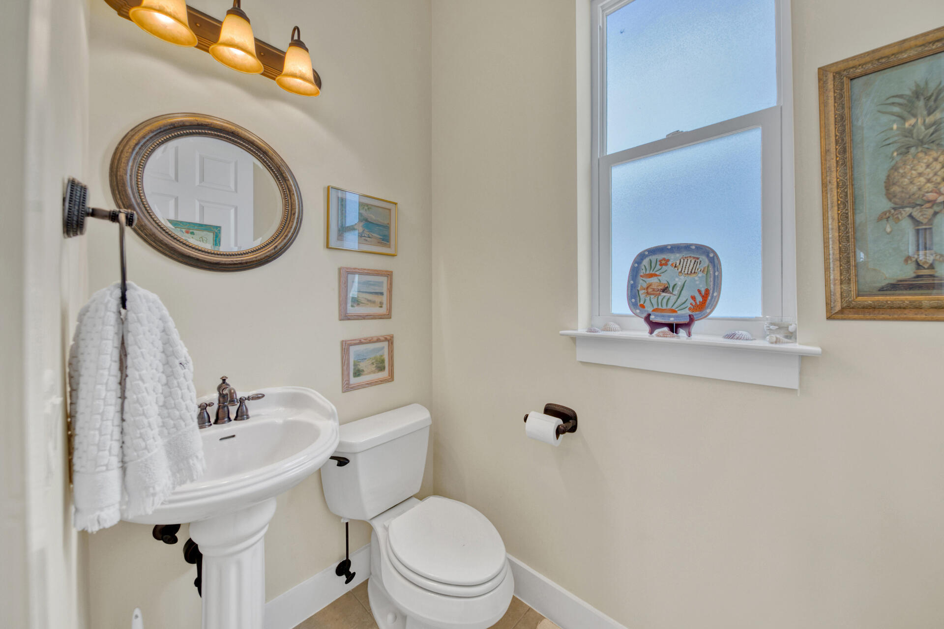 25 Pompano Place Inlet Beach, FL 32461 - Photo 32 of 76 a white toilet sitting next to a bathroom sink