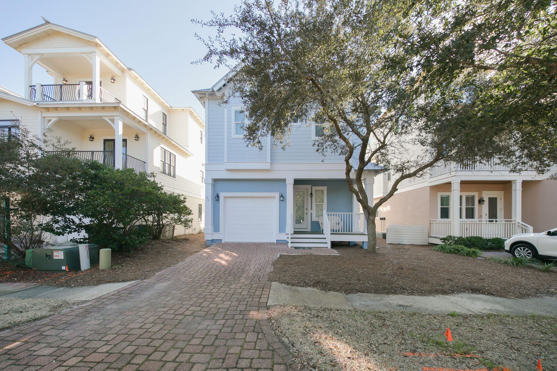 25 Pompano Place Inlet Beach, FL 32461 - Photo 6 of 76 a front view of a house with a yard and garage