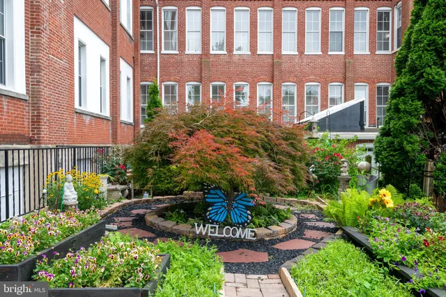 a view of a building with a garden