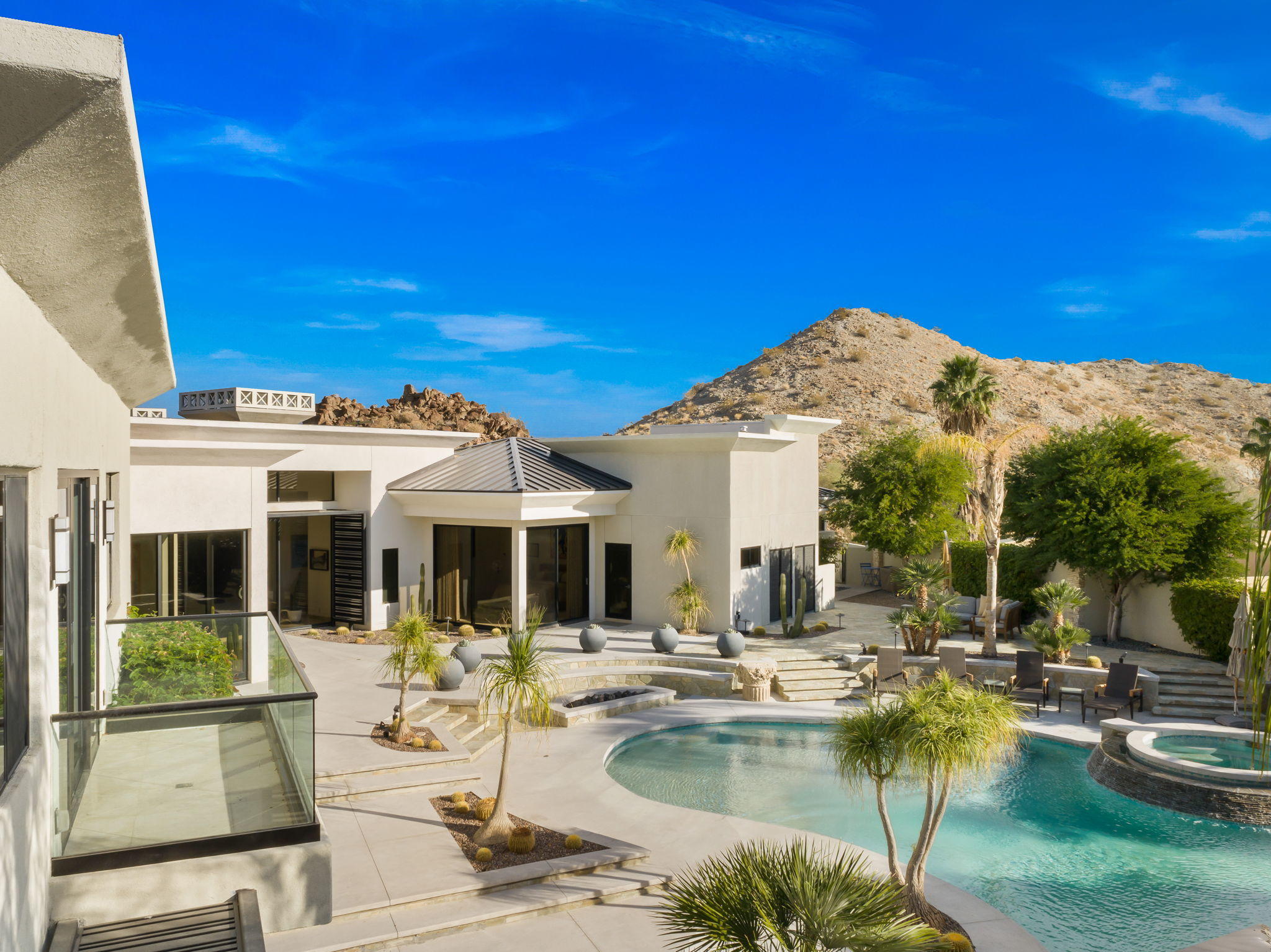 178 Netas Drive Palm Desert, CA 92260 - Photo 2 of 83 a view of swimming pool with outdoor seating and house in the background