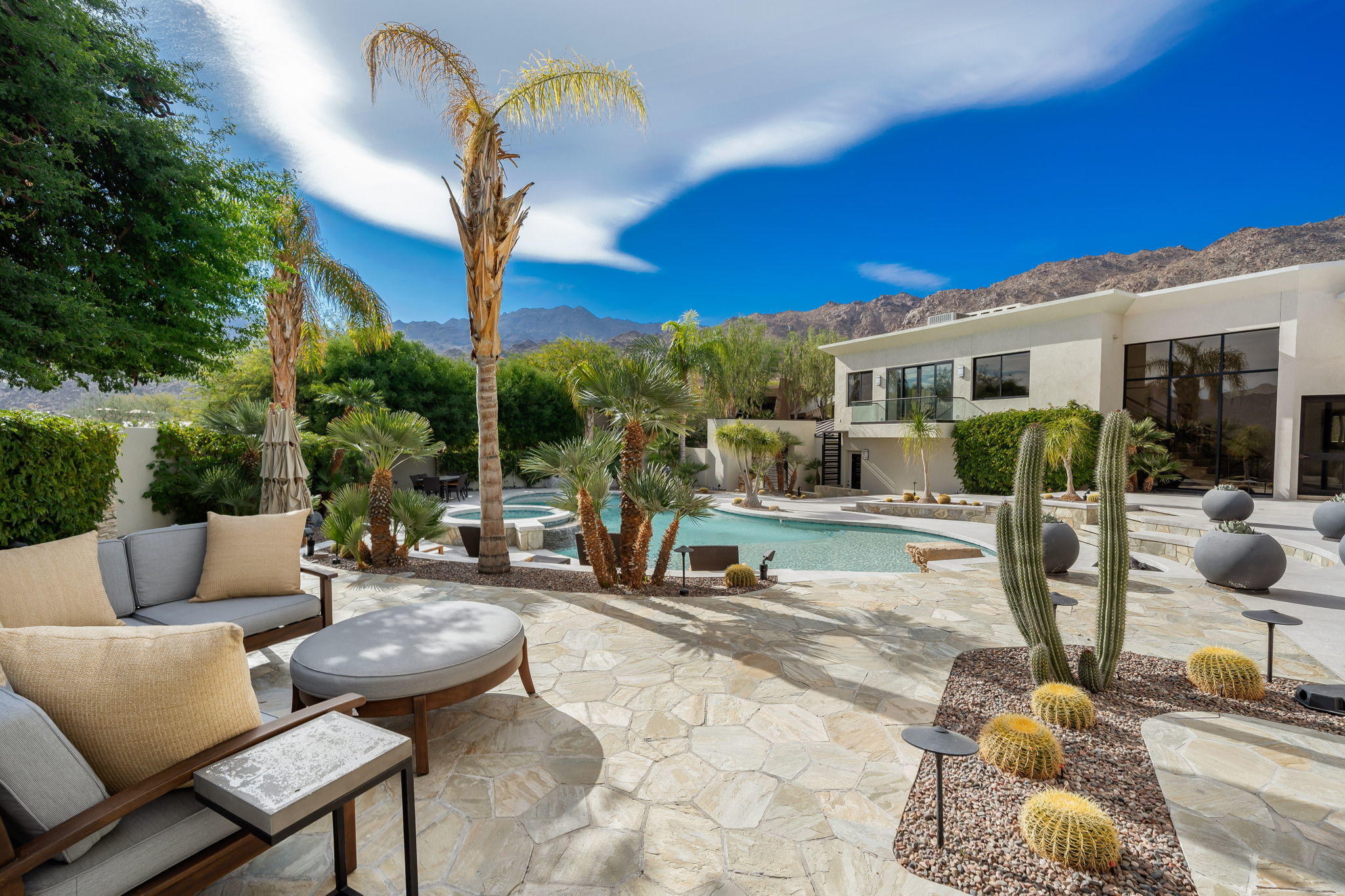 178 Netas Drive Palm Desert, CA 92260 - Photo 62 of 83 a view of a patio with swimming pool table and chairs