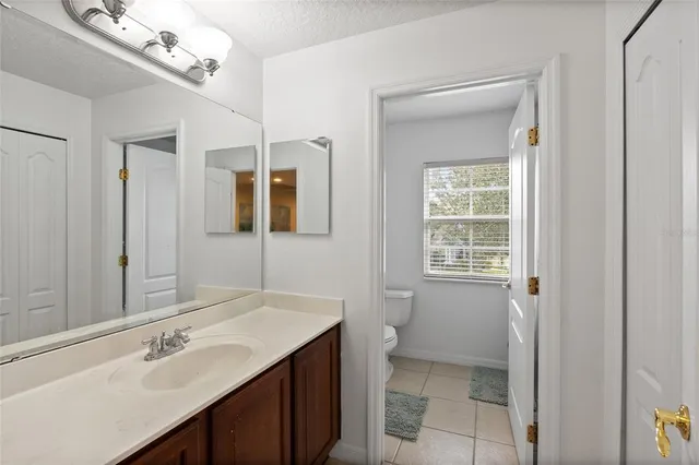 a bathroom with a sink a vanity and a mirror