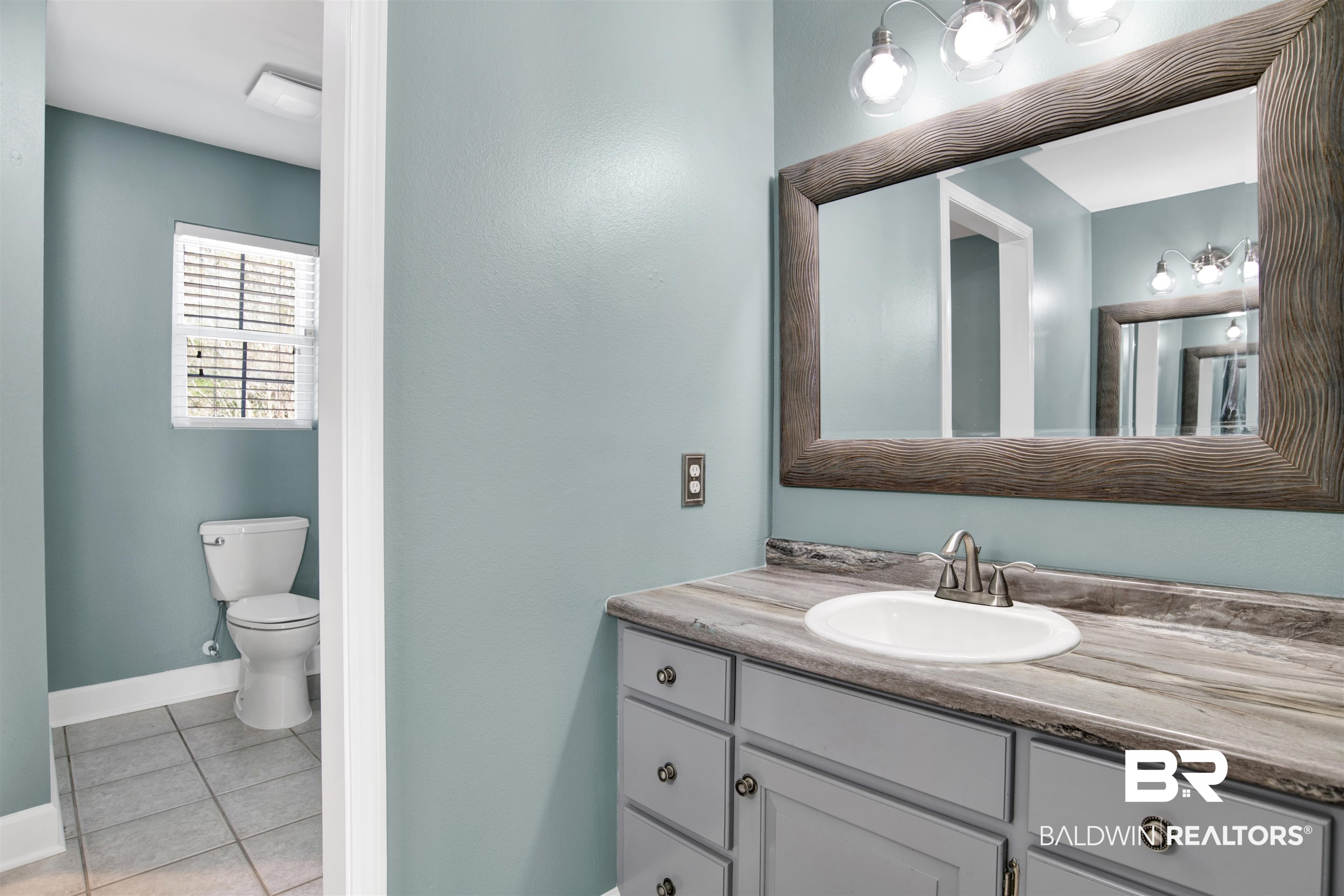 11835 Island Drive Foley, AL 36535 - Photo 15 of 53 Bathroom with vanity and light tile patterned floors