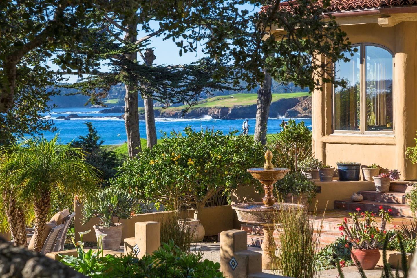 a view of building with bench and trees