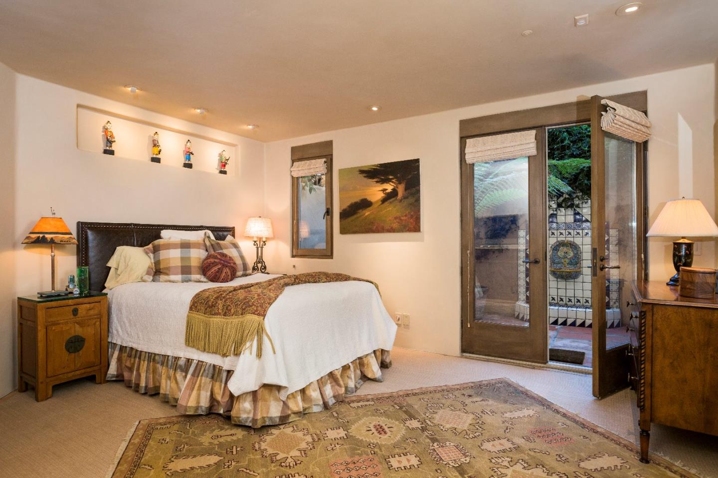 8 Carmel Way Carmel, CA 93923 - Photo 13 of 15 a bed room with a bed and a chair