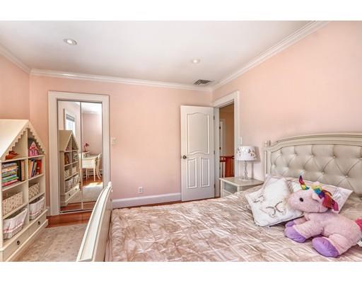 5 Grassmere Road Brookline, MA 02467 - Photo 7 of 12 a bedroom with a bed and wooden floor