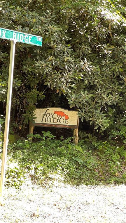 Lot 6 Fox Ridge Trail, Unit 6 Marion, NC 28752 - Photo 18 of 20 a view of a water fountain with wooden fence
