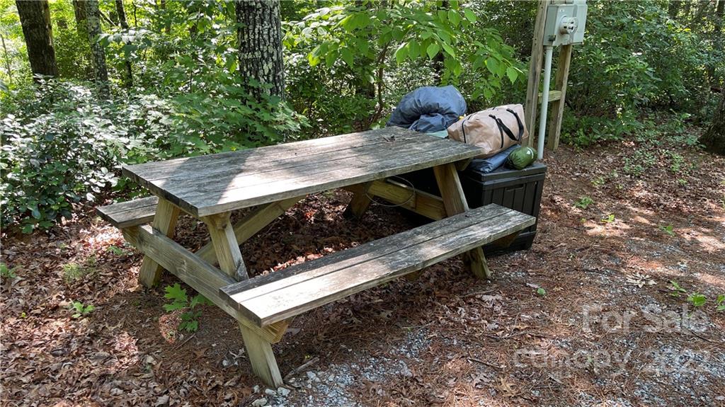 Lot 6 Fox Ridge Trail, Unit 6 Marion, NC 28752 - Photo 5 of 20 a view of a wooden bench sitting in the backyard