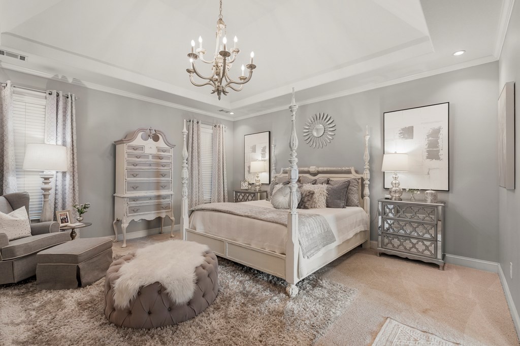 8014 Splendor Way Columbus, GA 31904 - Photo 14 of 58 a spacious bedroom with a bed a chandelier and a dresser
