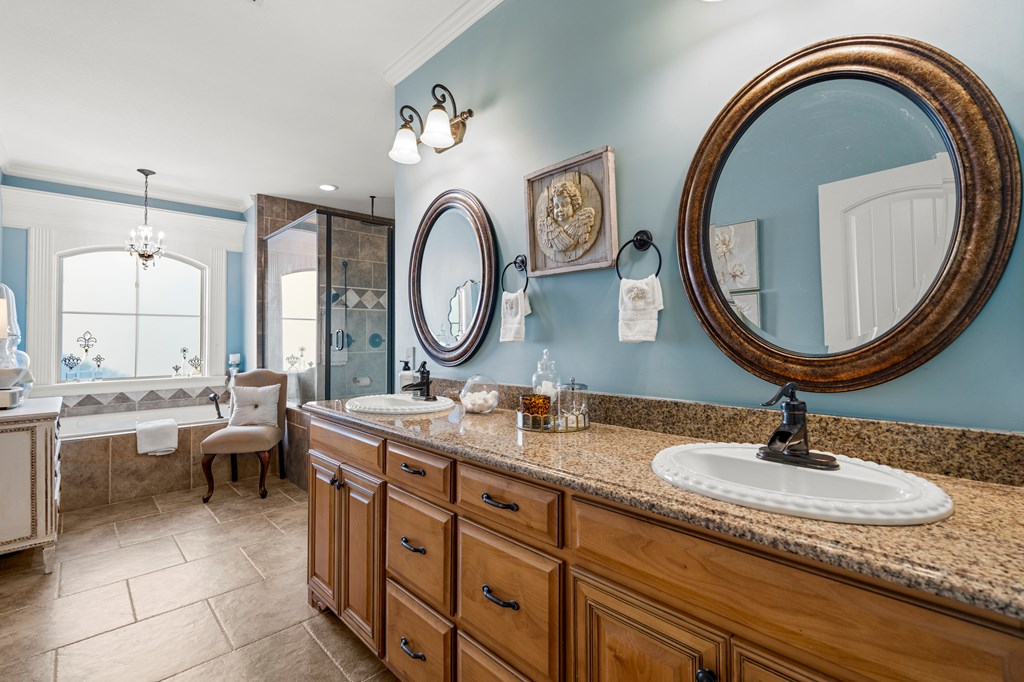 8014 Splendor Way Columbus, GA 31904 - Photo 17 of 58 a room with a double vanity sink and a mirror