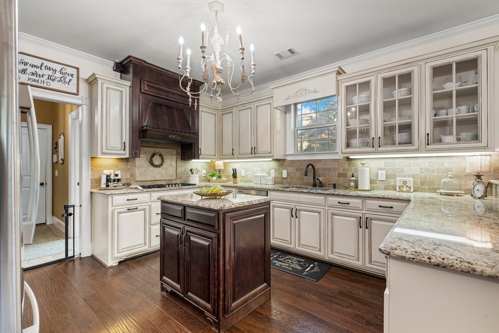 8014 Splendor Way Columbus, GA 31904 - Photo 23 of 58 a kitchen with stainless steel appliances granite countertop a sink stove and refrigerator
