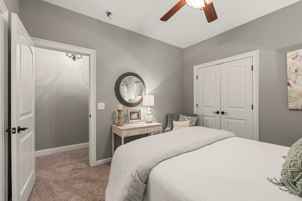 8014 Splendor Way Columbus, GA 31904 - Photo 39 of 58 a bedroom with a bed and a chandelier