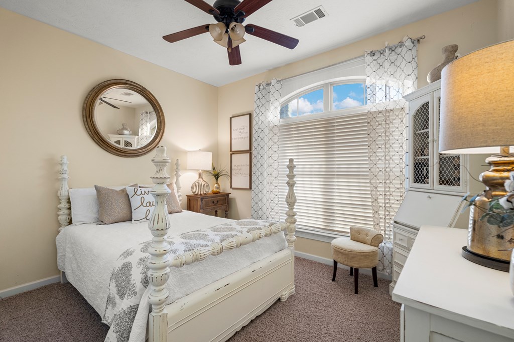 8014 Splendor Way Columbus, GA 31904 - Photo 44 of 58 a living room with furniture a chandelier fan and a large window