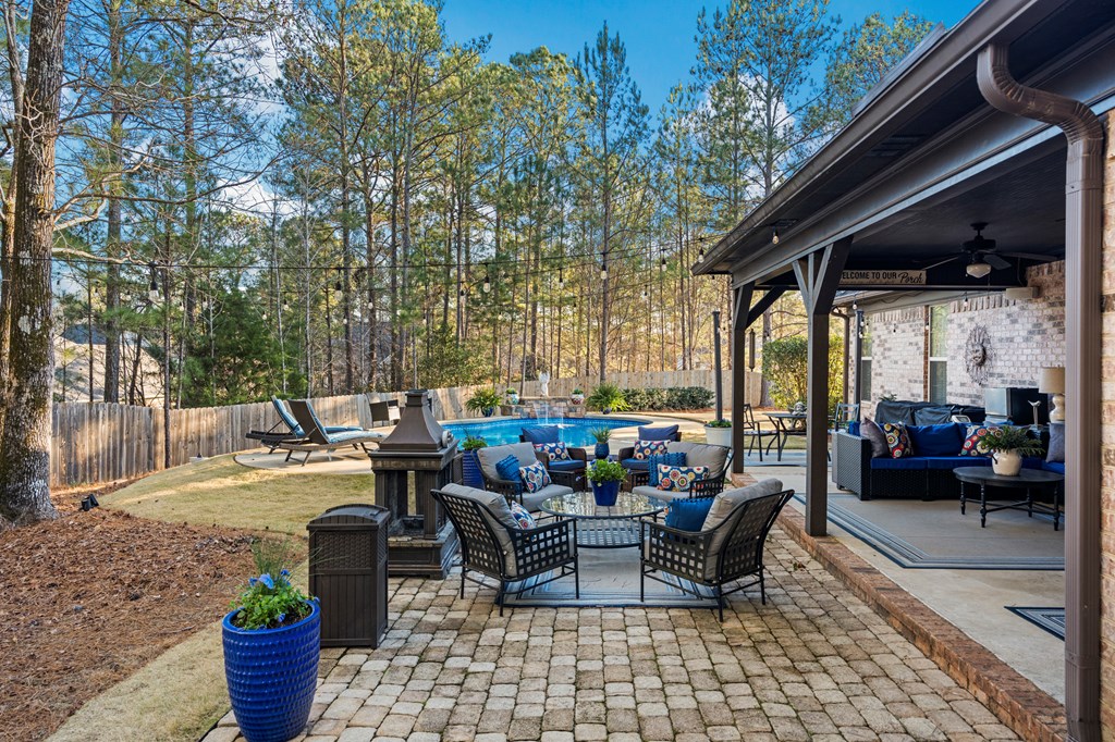 8014 Splendor Way Columbus, GA 31904 - Photo 47 of 58 a view of a patio with couches chairs and potted plants