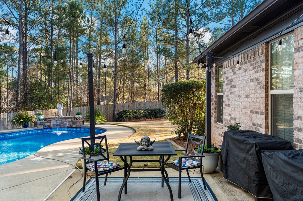8014 Splendor Way Columbus, GA 31904 - Photo 48 of 58 a view of a patio with table and chairs and wooden floor
