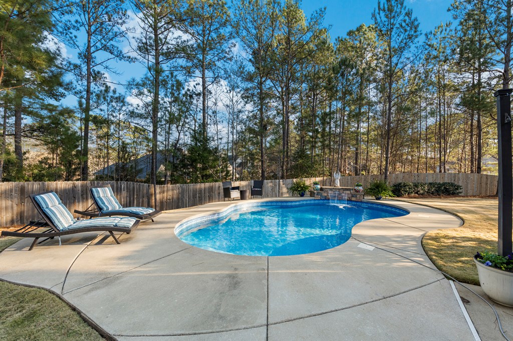 8014 Splendor Way Columbus, GA 31904 - Photo 49 of 58 a view of a swimming pool with a lounge chair