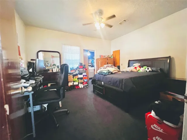 a bedroom with furniture and natural light