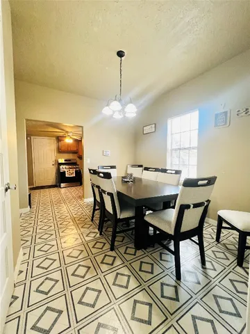 a view of a dining room with furniture